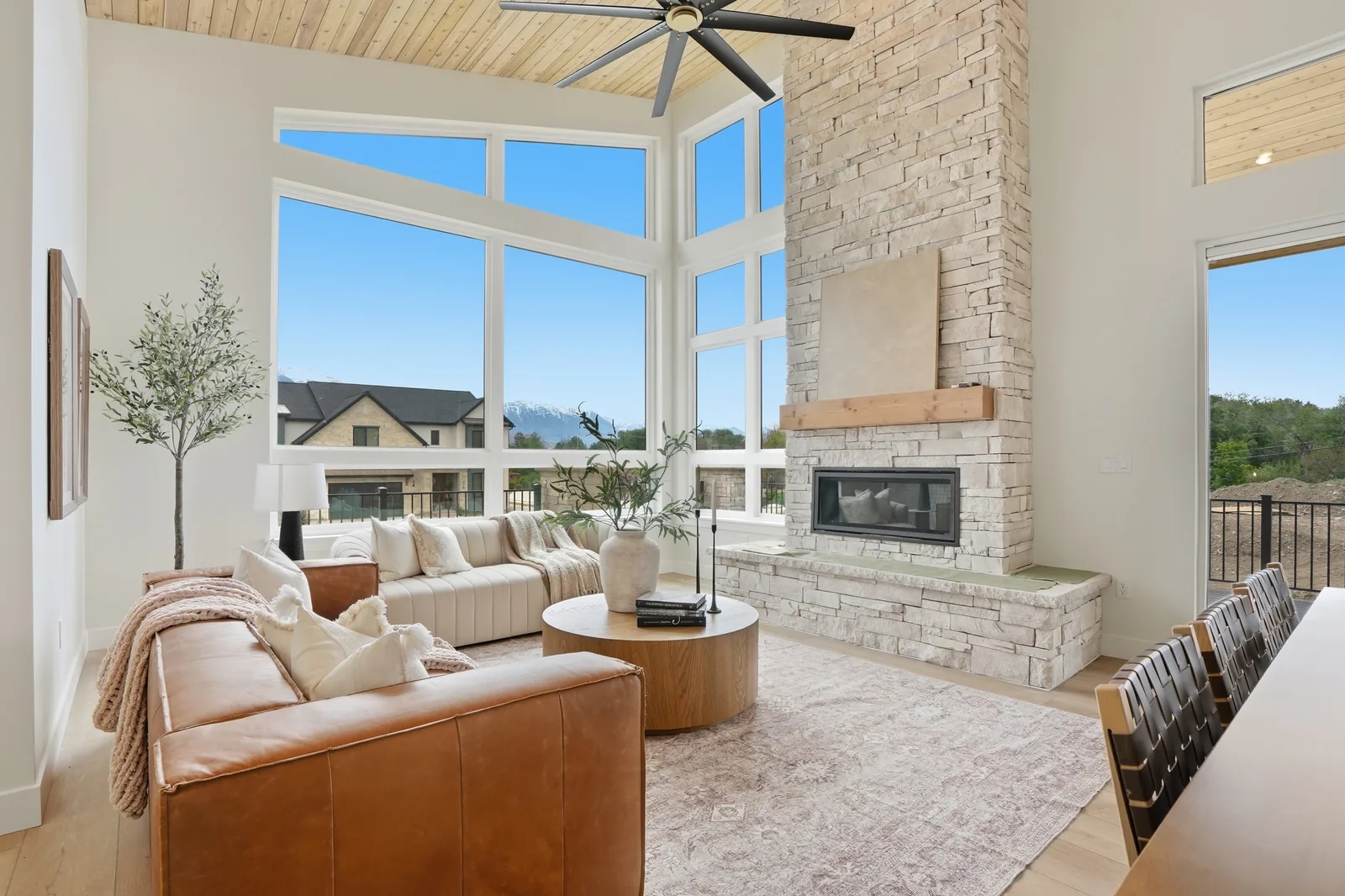 Goldcrest Denali II living room with large windows and mountain views